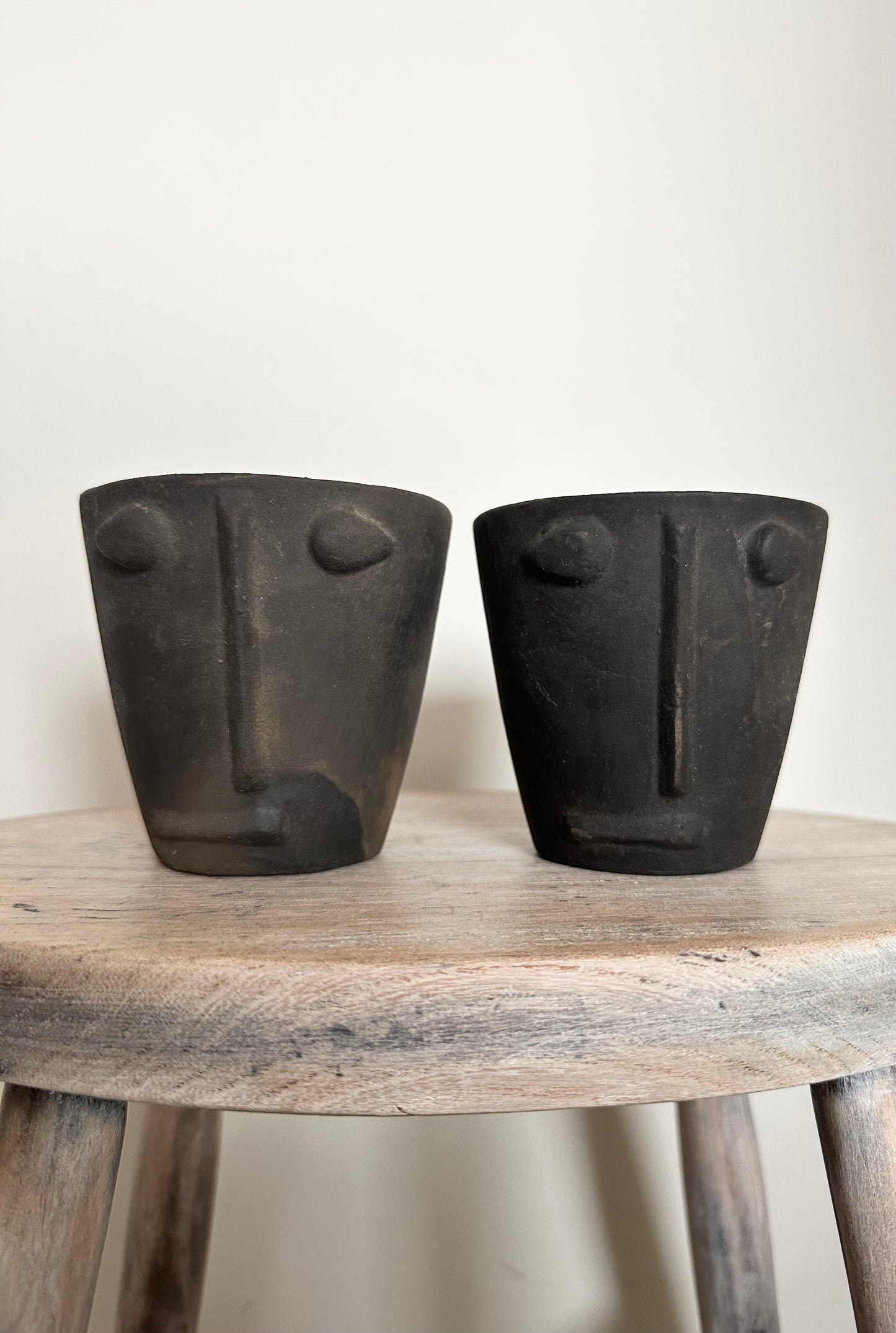 Handmade clay flower pot with face imprint